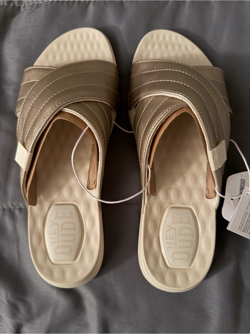 NWT Hey Dude Christi metallic gold slides. Size 6.